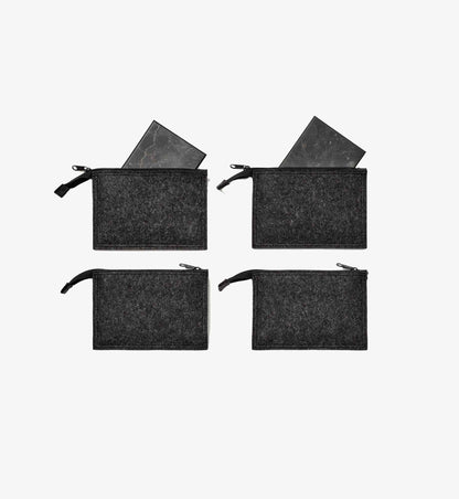 Platten Max aus EssenceX-Schungit von Beyond Matter, Set mit vier Platten, freigestellt auf hellem Hintergrund.